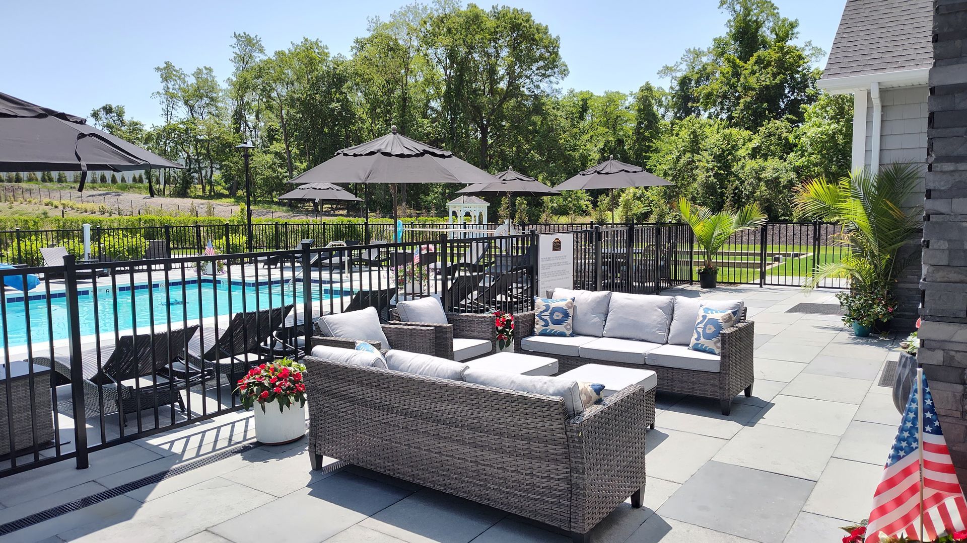 The Villas at Setauket- pool and patio furnitures and fence