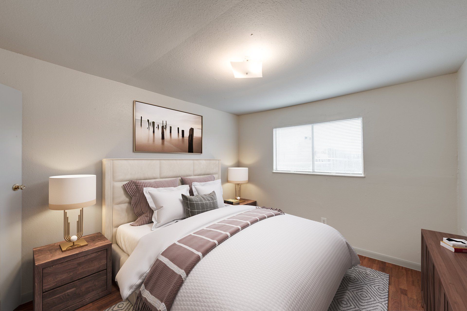 Spacious, well-lit master bedroom in a one-bedroom apartment for rent in Houston, with a large bed.