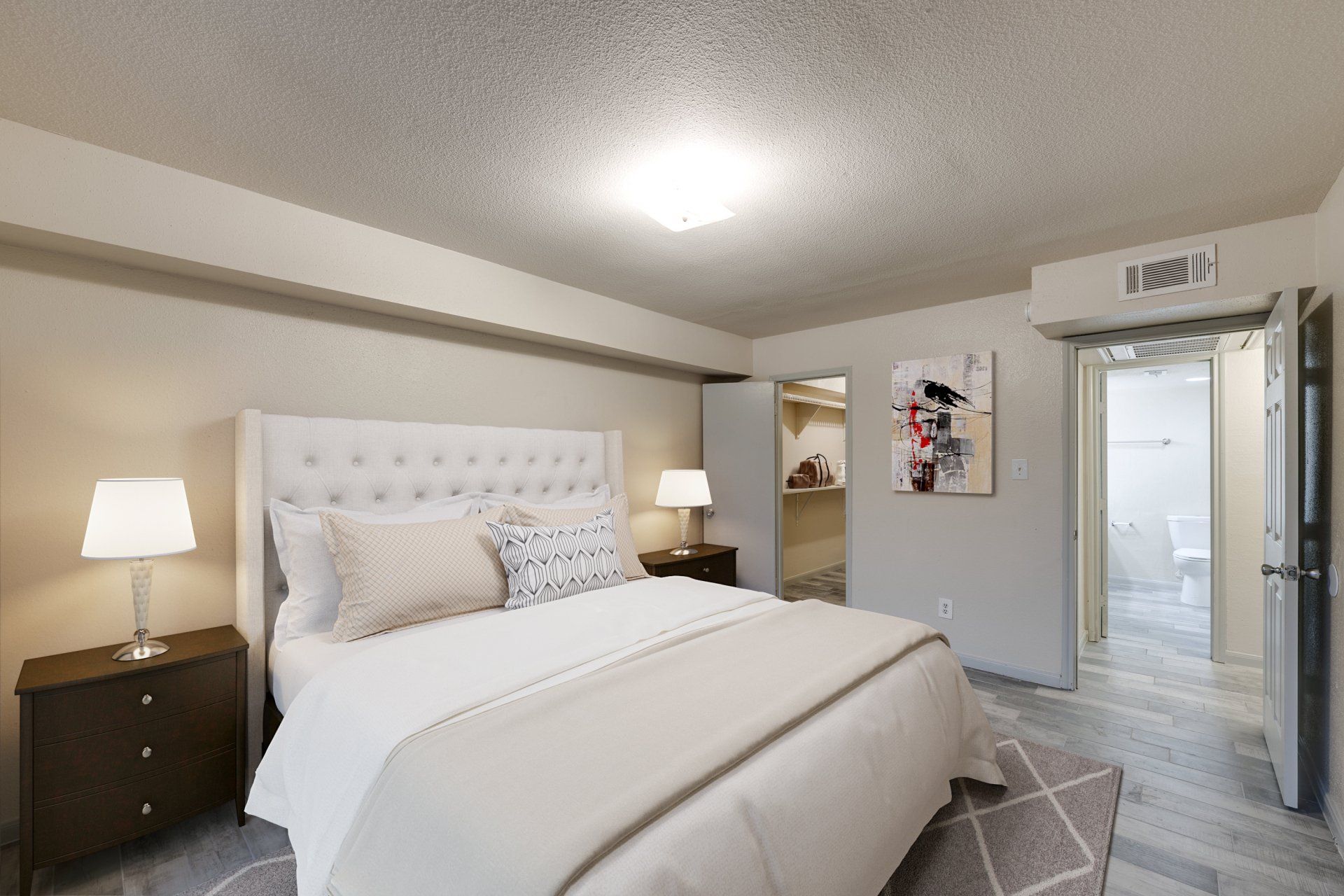 Gia Oak Forest, Houston: bedroom with spacious walk-in closet, luxury plank flooring.