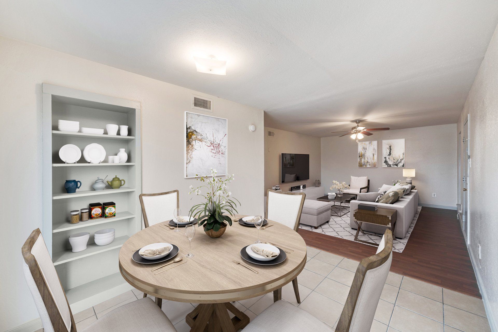 Spacious living room with modern sectional, natural light in a Houston apartment for rent.