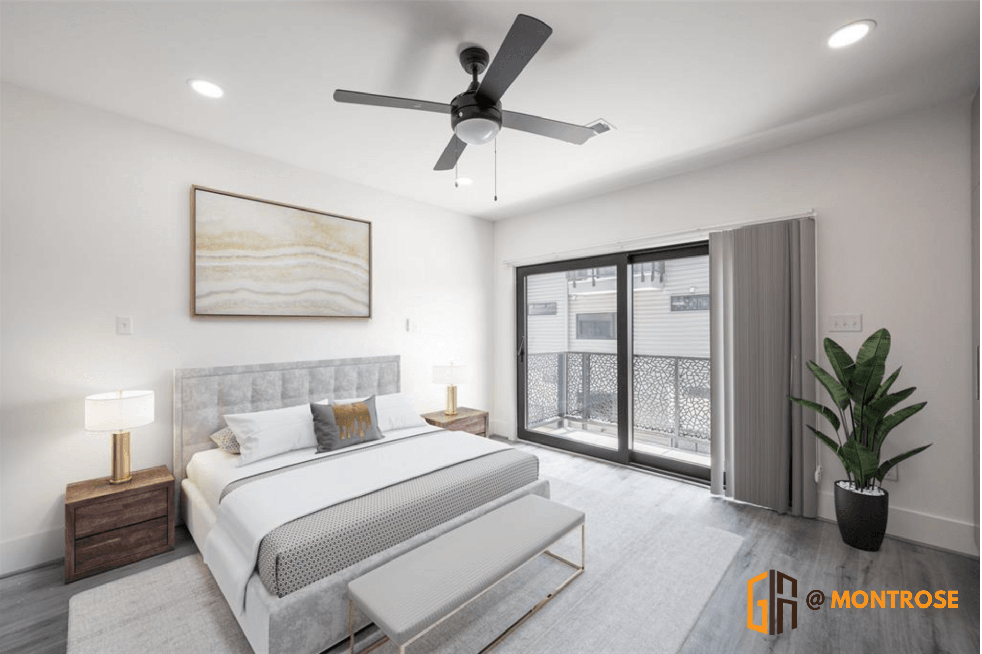 Modern Houston apartment bedroom with a gray upholstered bed, bench, and a private balcony.