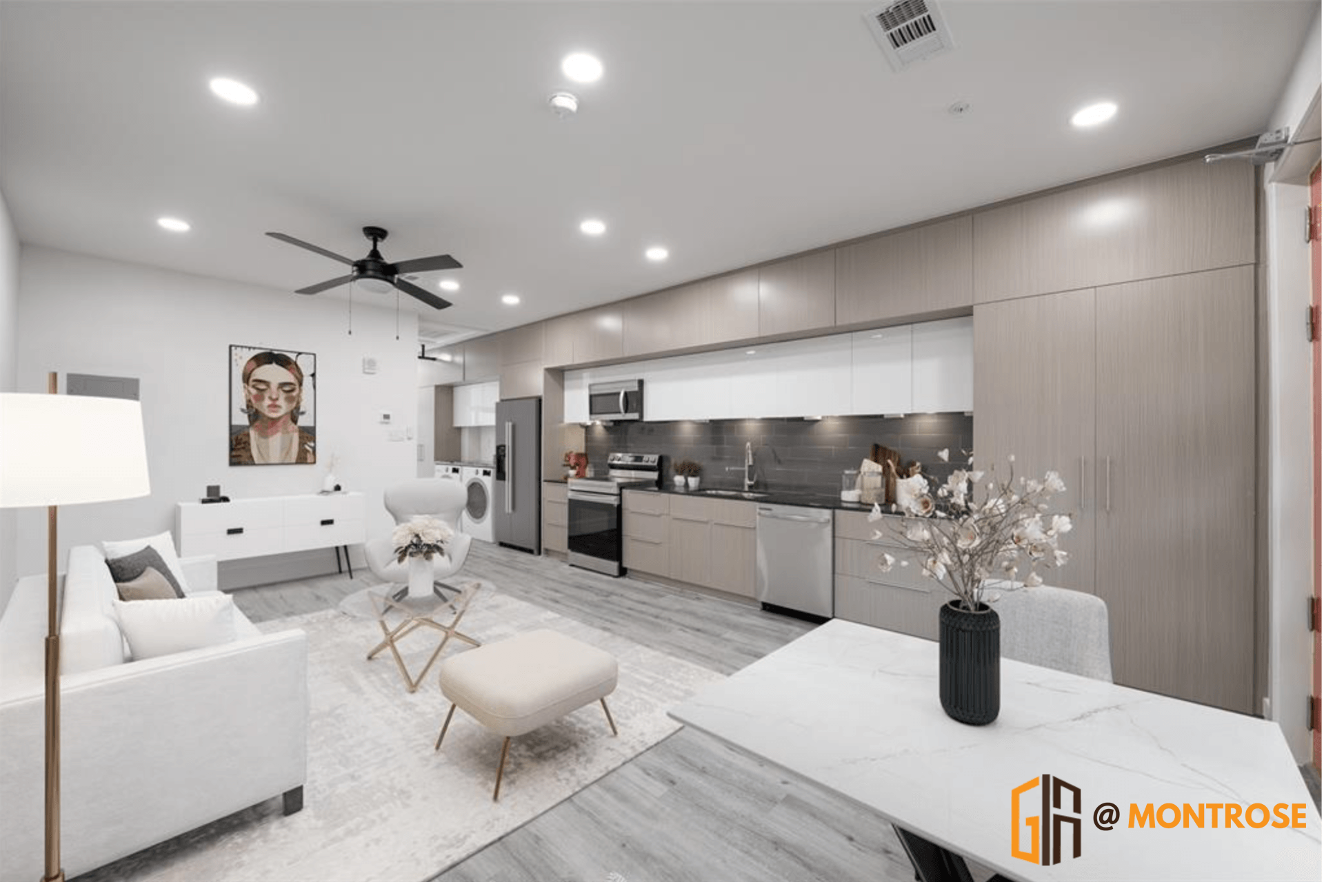 Stylish Montrose apartment with open living area, stainless steel appliances, and light cabinetry.