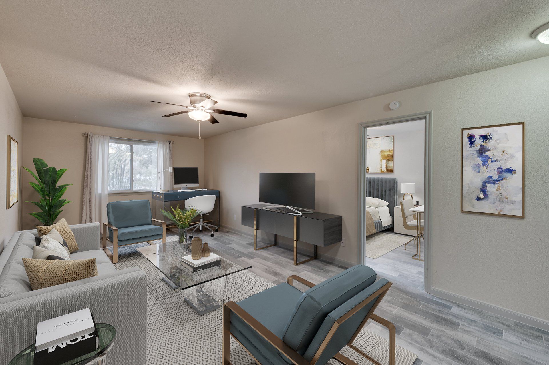 Modern living room at GIA Westchase with dedicated workspace, showcasing Westchase District Houston apartments.