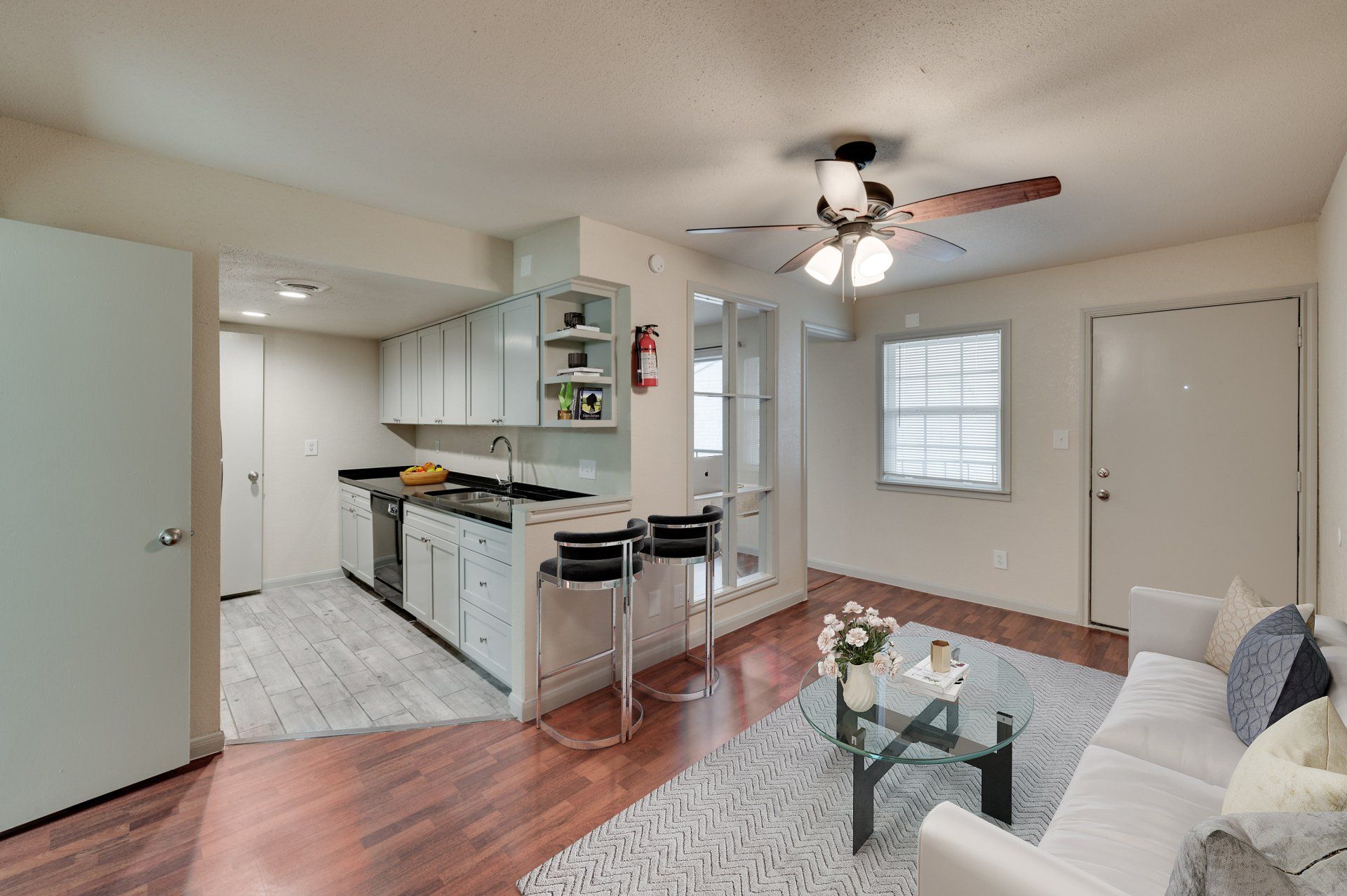 Modern open concept living room and upgraded kitchen at GIA Westchase, offering Westchase District Houston apartments.