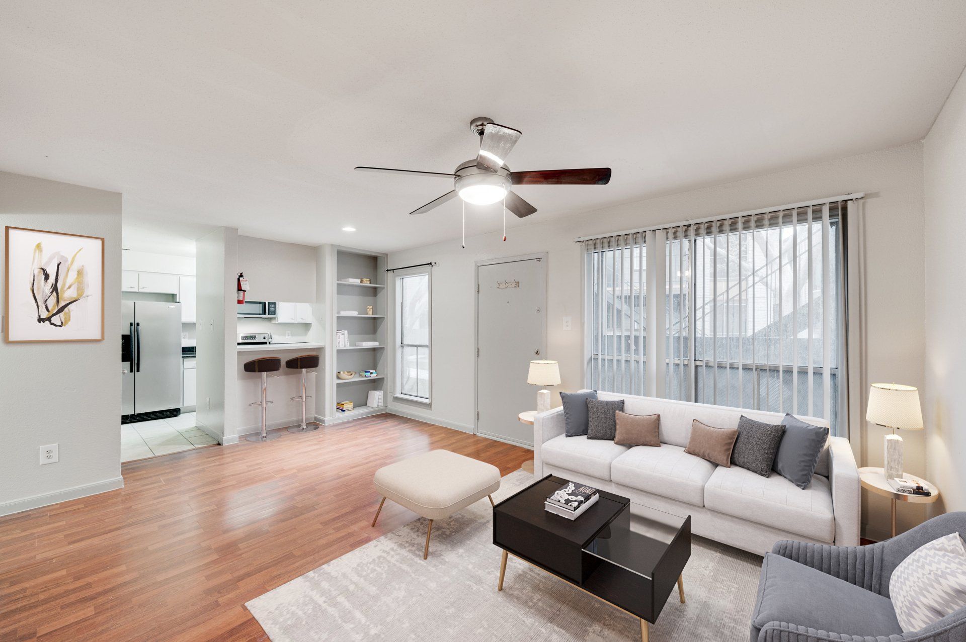 Modern, remodeled living space in Gia Westchase, showing Westchase District Houston TX apartments for rent with open kitchen.