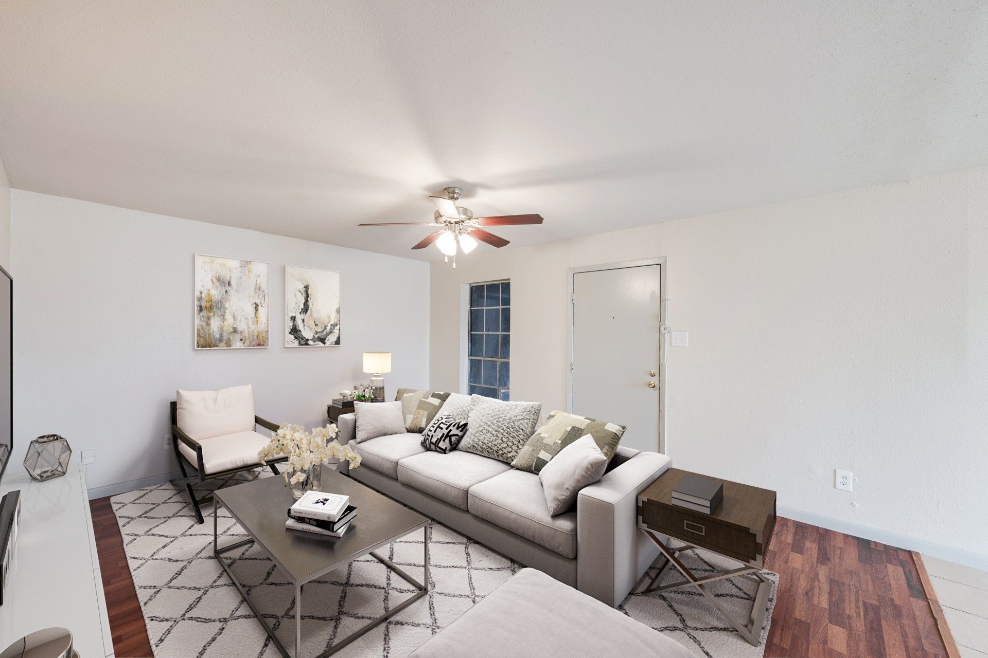 Spacious living room in a luxury Houston apartment for rent, featuring modern furnishings and private balcony access.