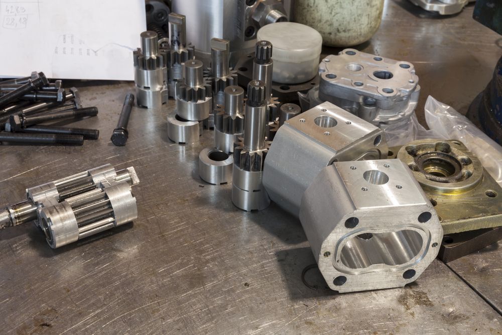 Hydraulic Engine Parts on the Work Table — Providing Hydraulic Component Repairs in Ballina, NSW