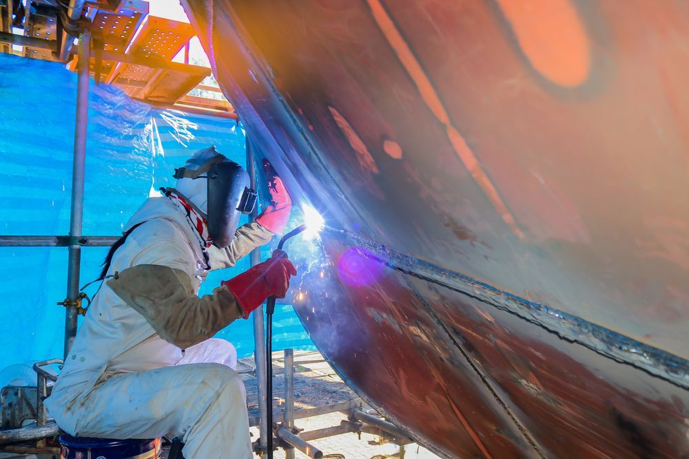 Skilled Welder Fabricating a Hull in a Shipyard — Hydraulic Repairs in Ballina, NSW