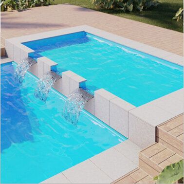 A swimming pool with a waterfall in the middle of it