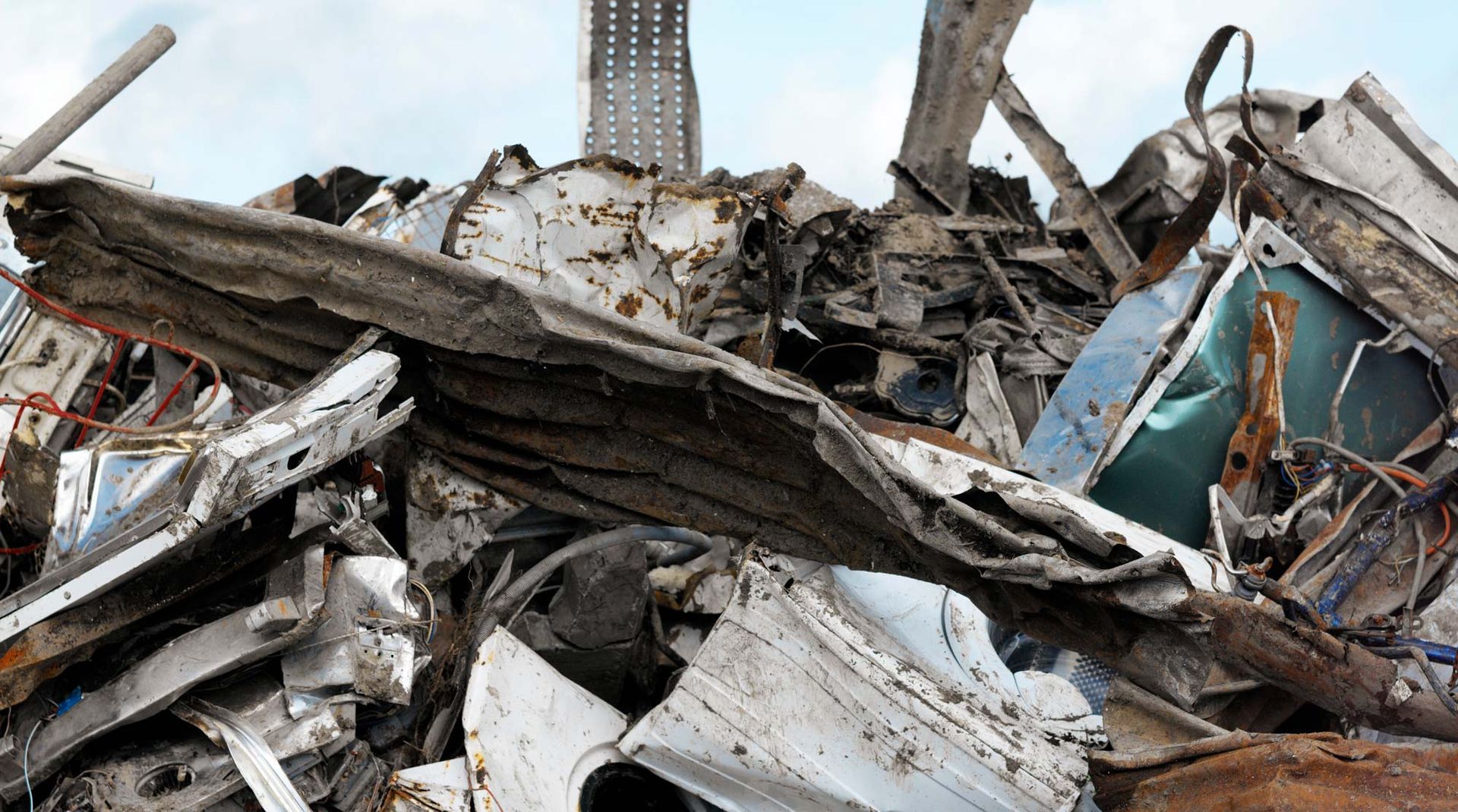 A disorganized pile of junk at a metal scrap yard in Chicago Heights, IL, showcasing various discard