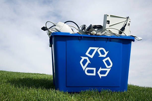 A blue recycling bin with electronics at American Scrap Metal, a metal scrap yard in Alsip, IL, serving Chicago Heights, IL.