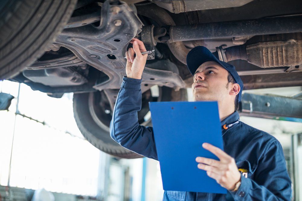 Mechanic Checking Under of Car — Trusted Mechanic in Mid North Coast