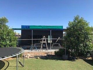 A Trampoline Is Sitting in Front of A House Under Construction — Edwards & Froud Building Services Pty Ltd in Gunnedah, NSW