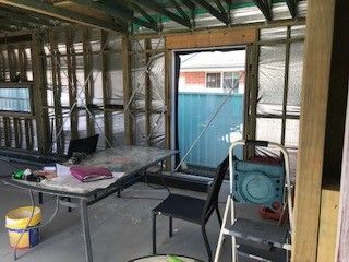 A Room with A Table , Chairs and A Ladder in It — Edwards & Froud Building Services Pty Ltd in Gunnedah, NSW