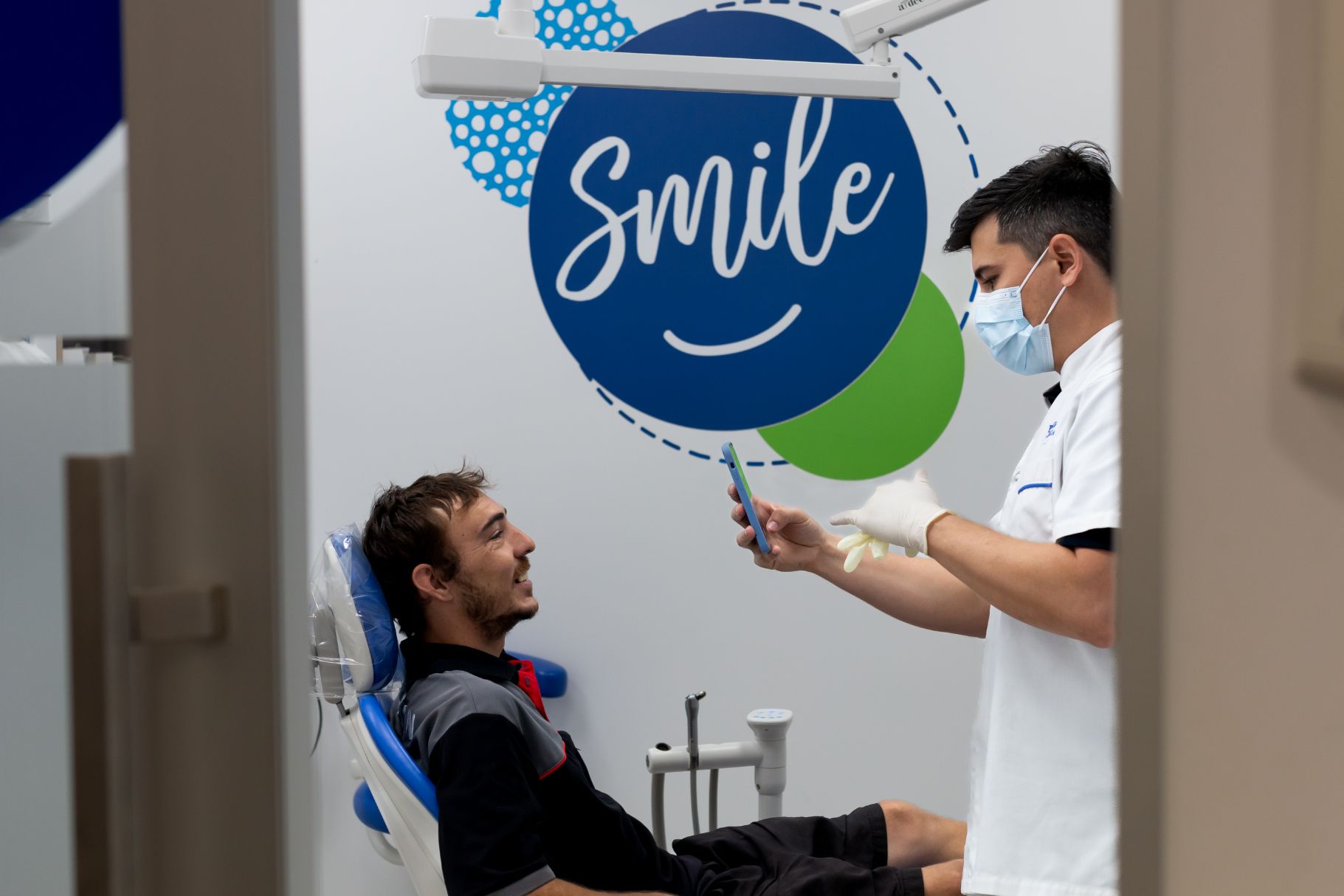Dentist Taking Photo of Patient's Teeth in a Dental Office — Dentures Direct Ballina In Ballina, NSW