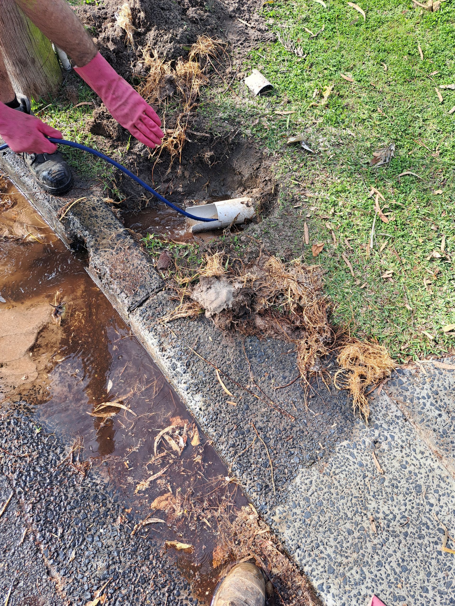 A Person is Using a Snake to Drain a Sink — All About Quality Plumbing Services In Halekulani, NSW