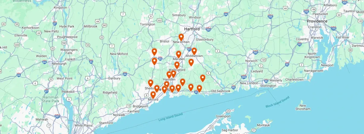 A map of southern Connecticut with orange pin markers clustered in the New Haven and Shoreline areas.