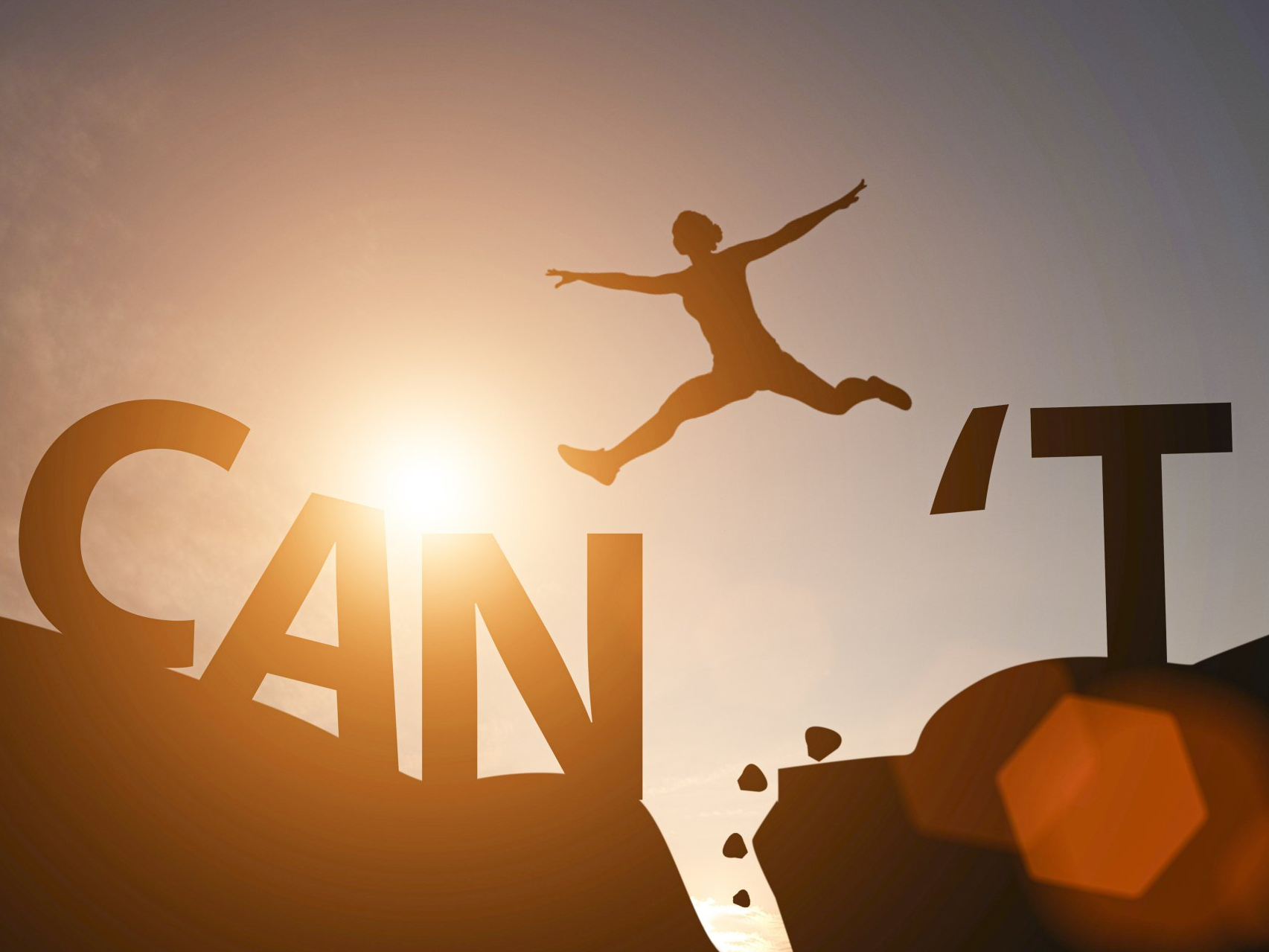 Image of a person leaping between two rocks with the word 'can' on one side and 't' on the other- so can't..
