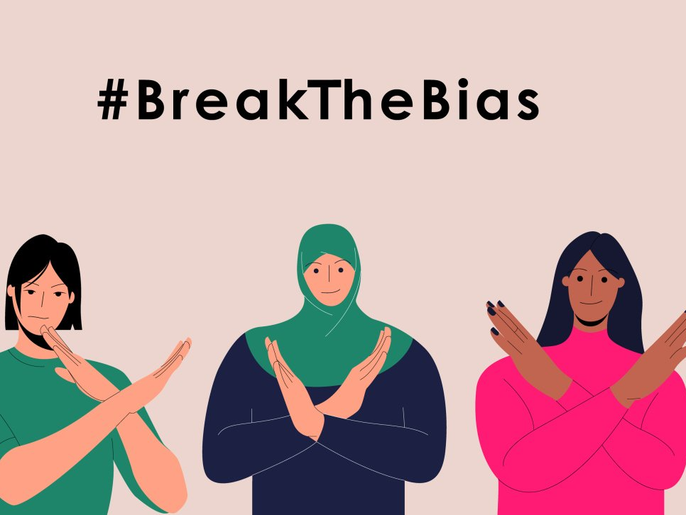 Image showing three women supporting International Women's Day, with their arms shaped in a cross. And the caption #BreakTheBias.