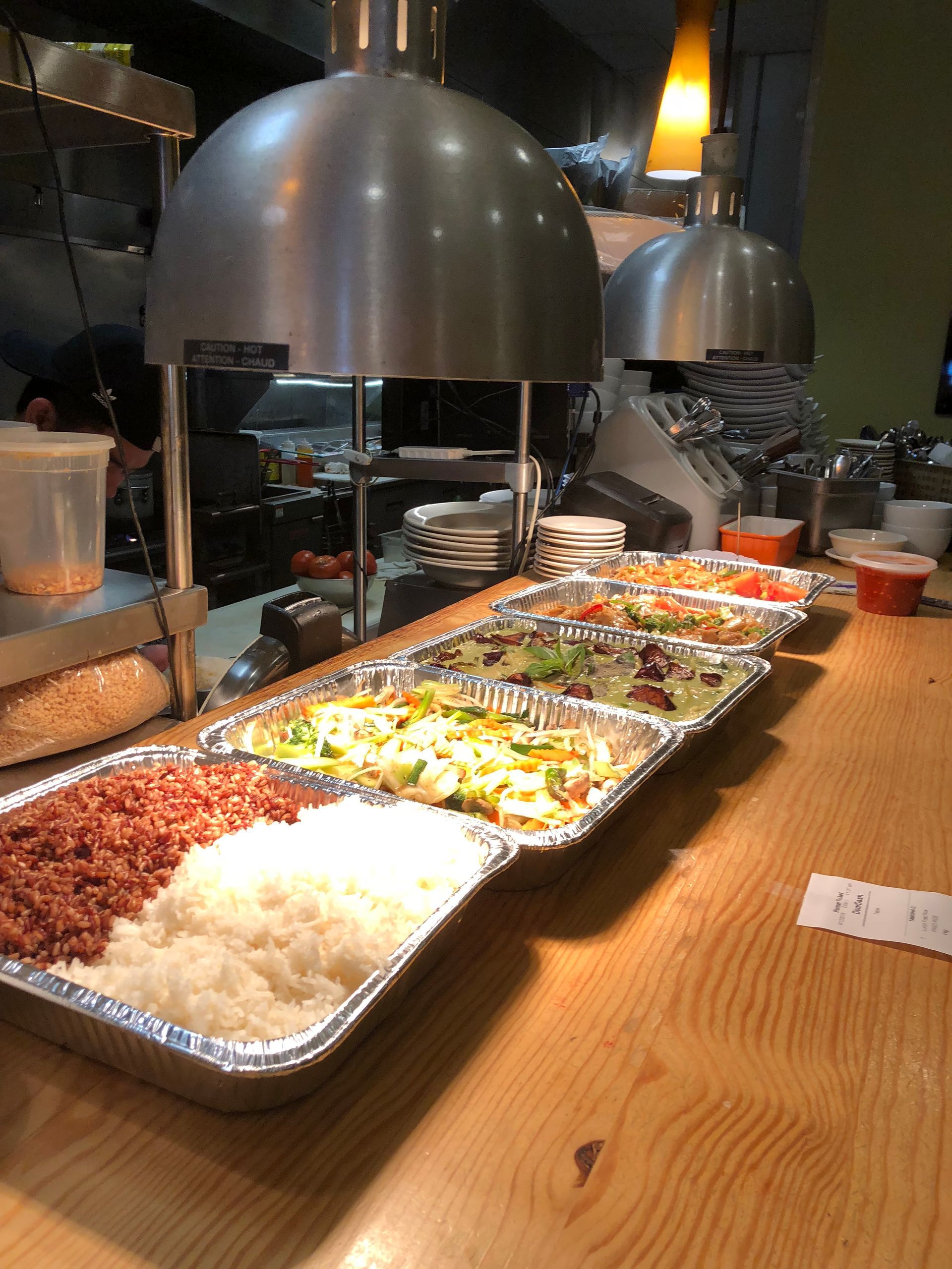 catering trays lined up of thai food