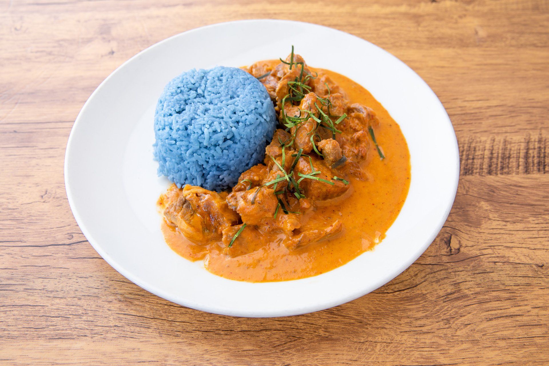 Blue rice and beef curry plate