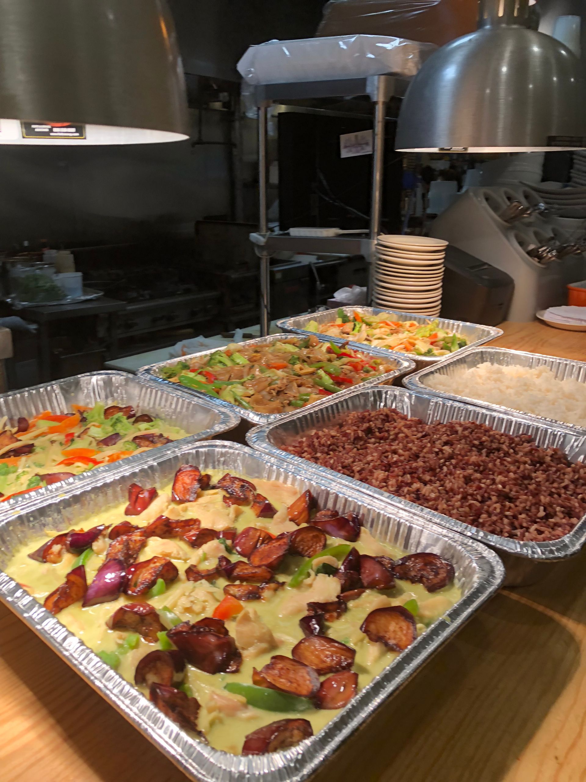 Aluminum trays of prepared food.