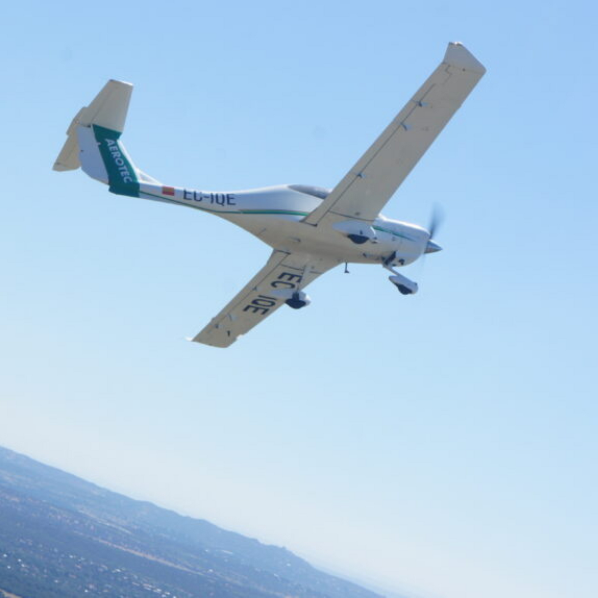 A small plane with the letters ec on the tail