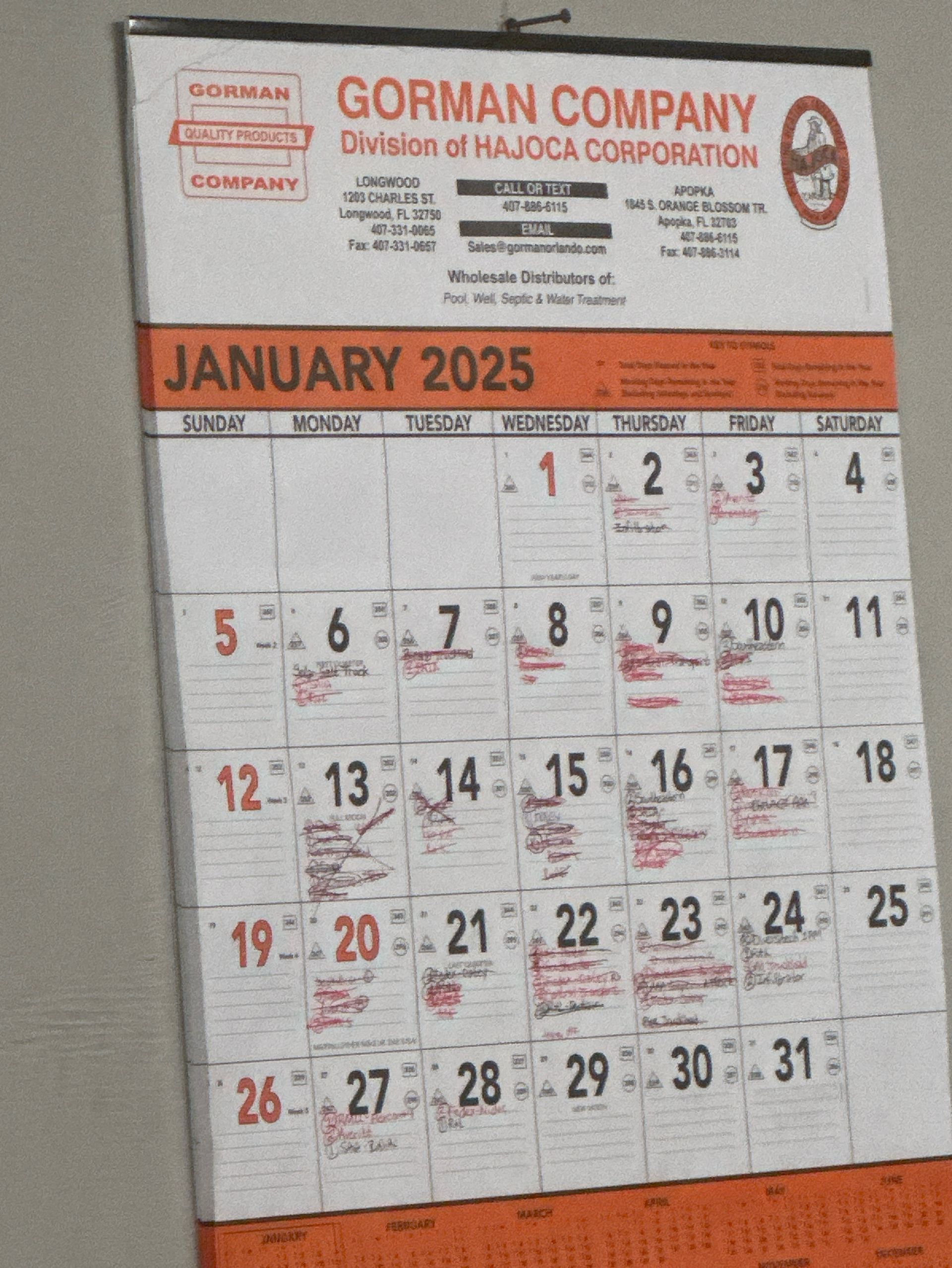 A calendar for the year 2025 hangs on a wall