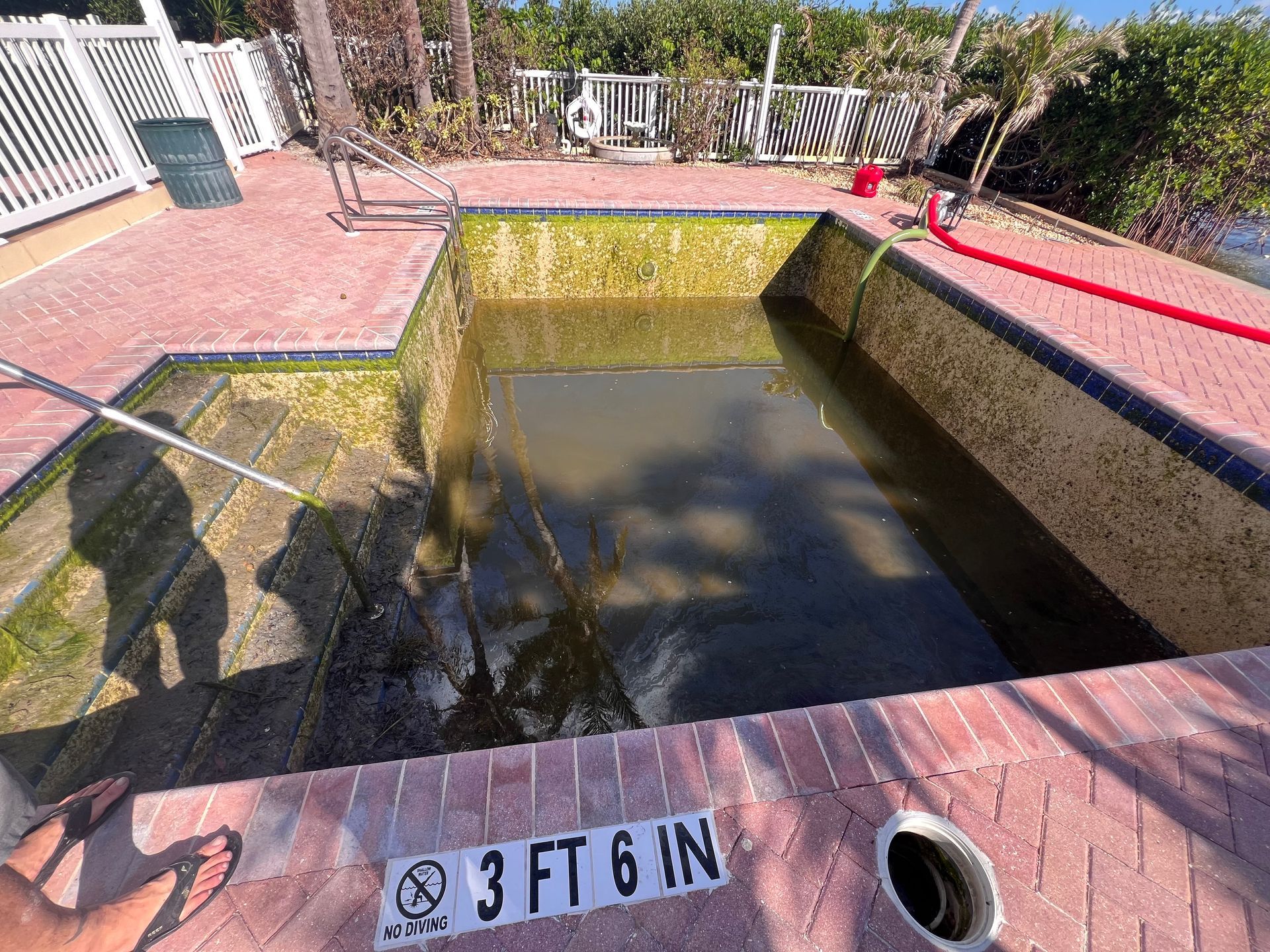 A swimming pool with a license plate that says 3 ft 6 in.