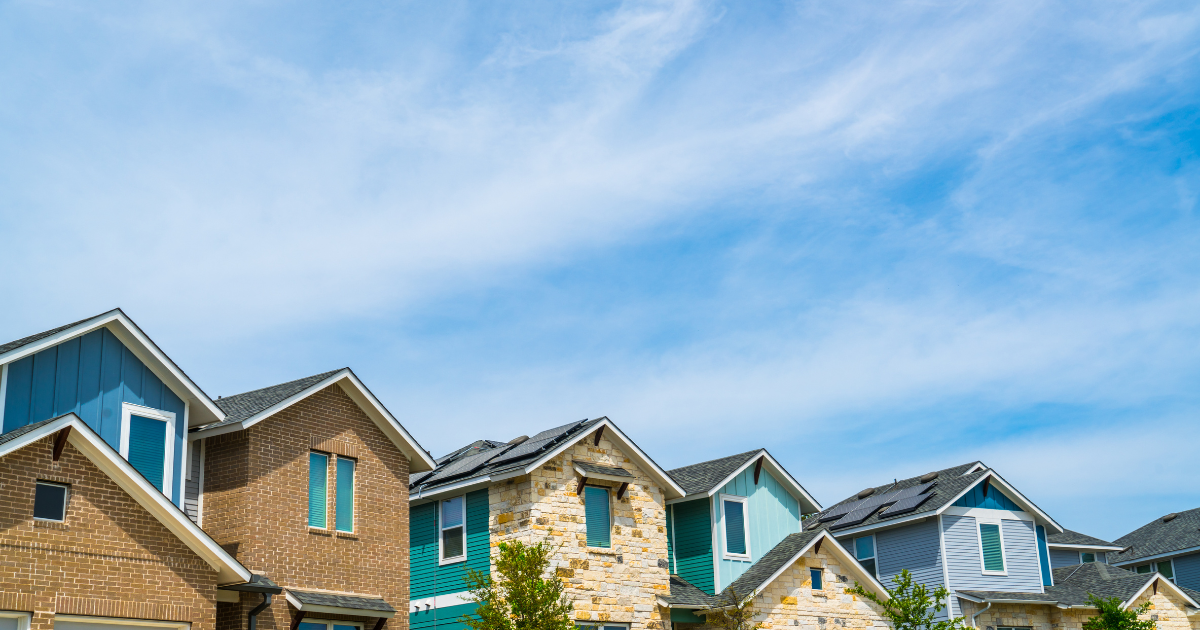 A modern house with a swimming pool and a lot of windows.