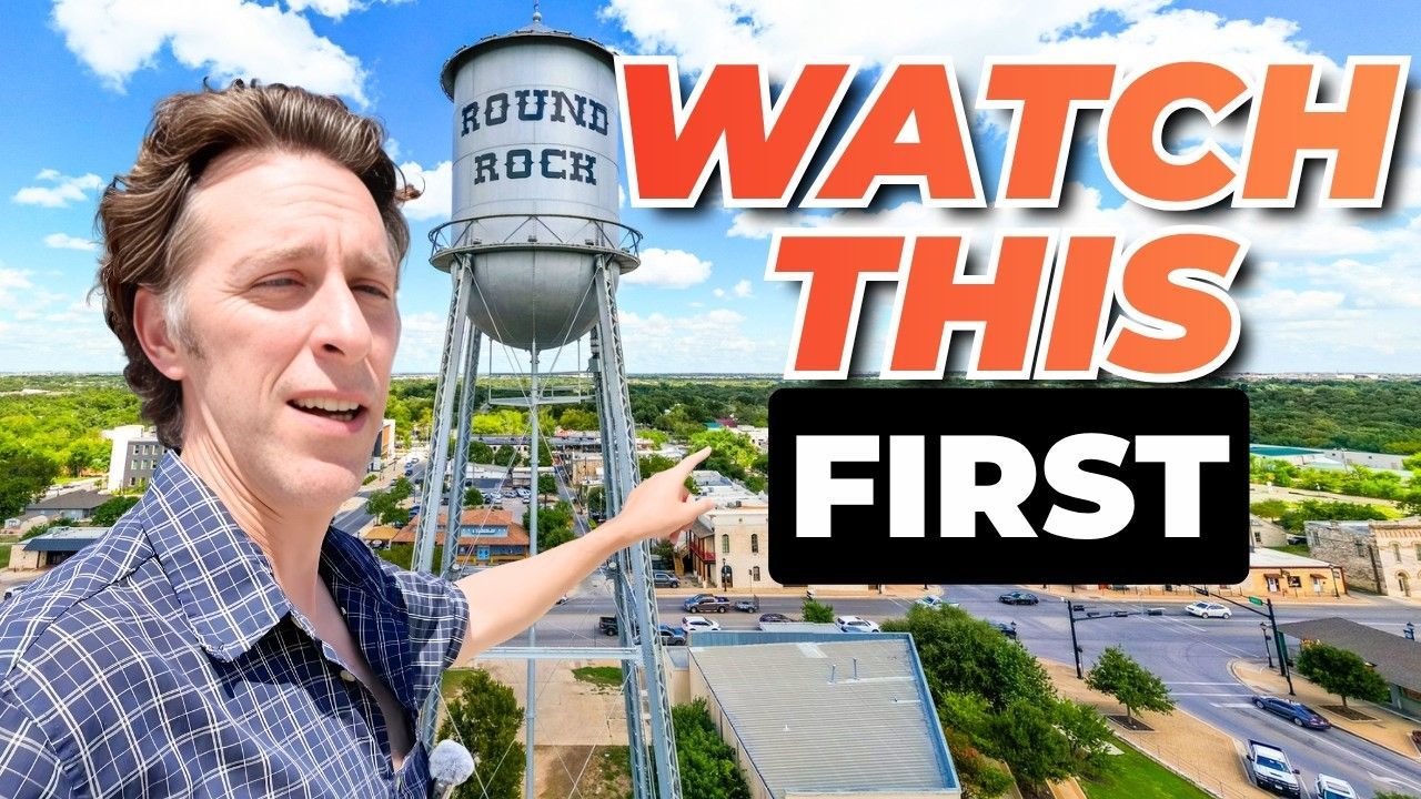 A person points at the Round Rock water tower in a town square under a bright, sunny sky. Large text says WATCH THIS FIRST.