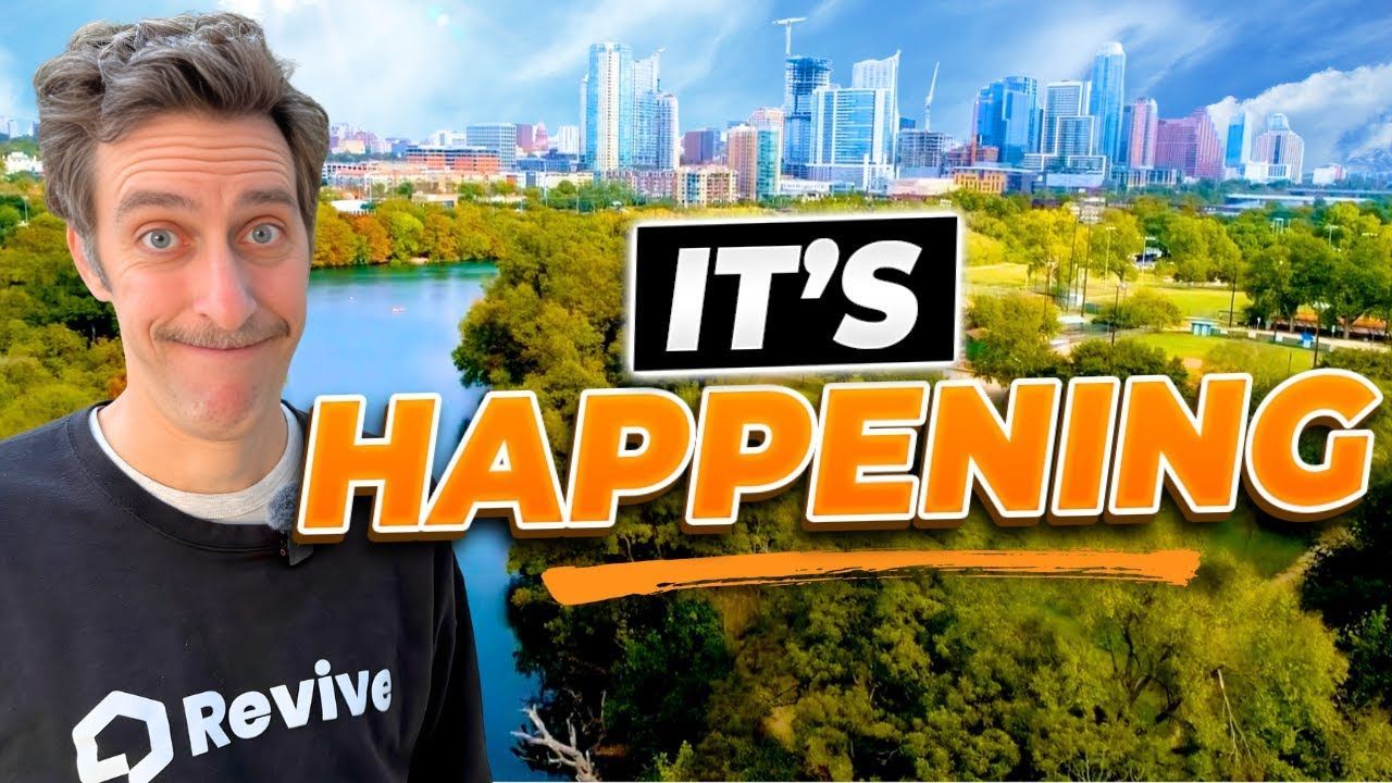 Man with mustache in front of a river, city skyline, and 