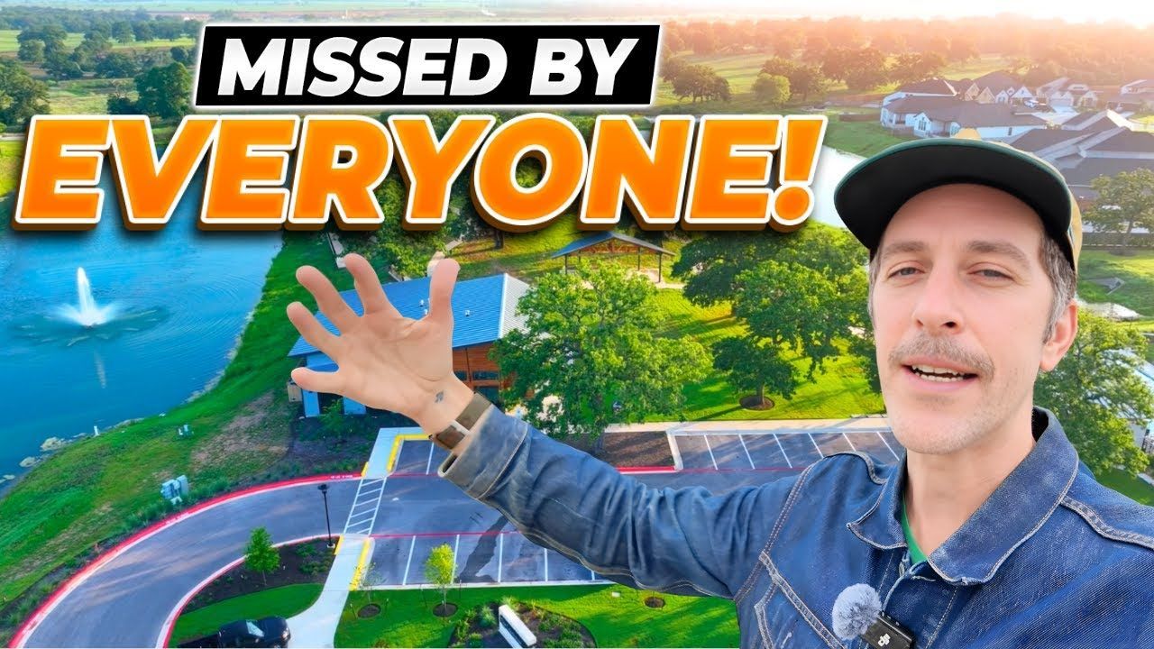 Man gesturing toward a scenic suburban area with a lake and text 