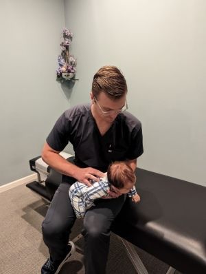 Chiropractic Doctor With Baby