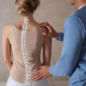 Person with Scoliosis Visiting the Chiropractor