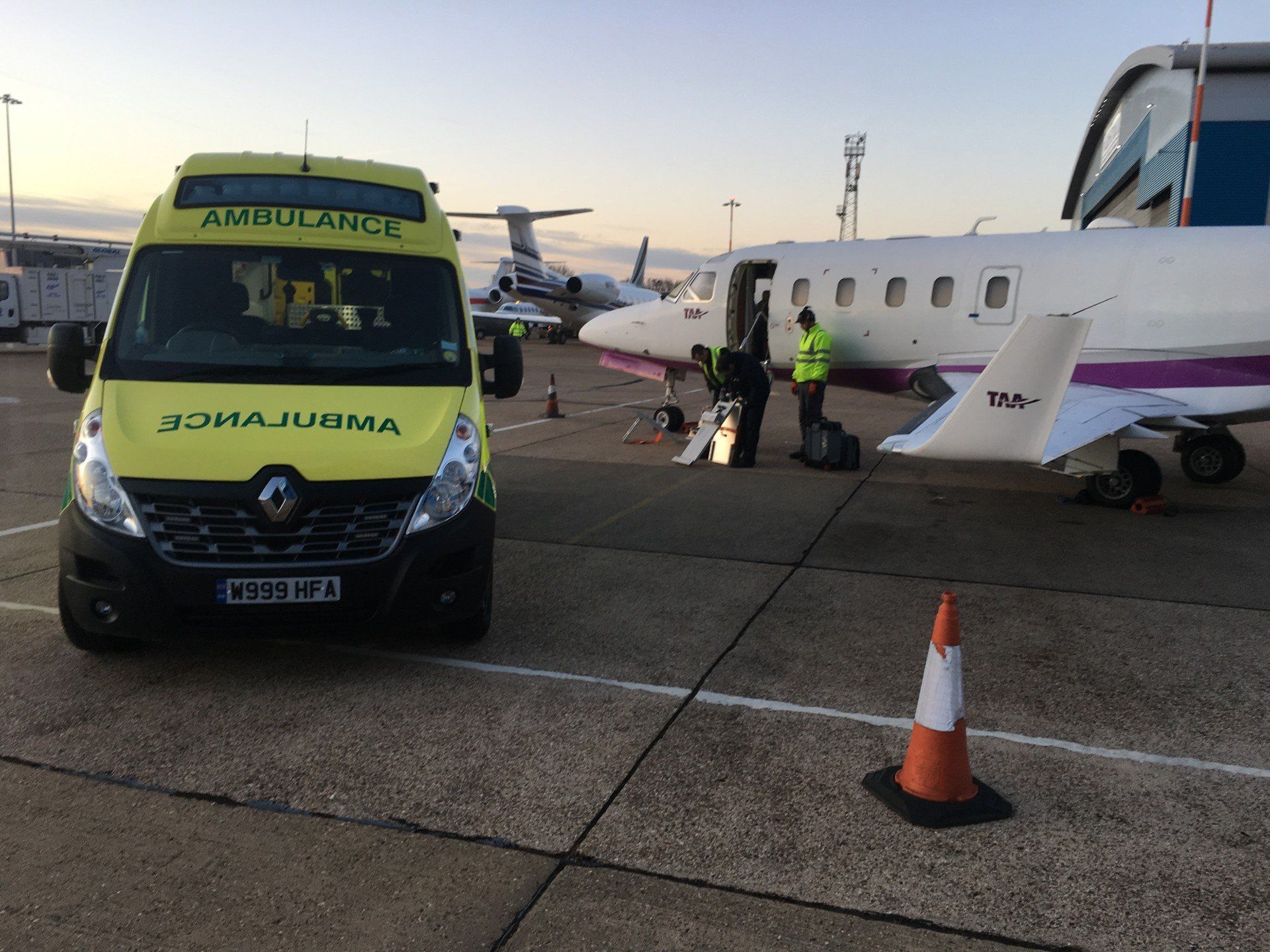 Hearts First Ambulance Service vehicle with a plane
