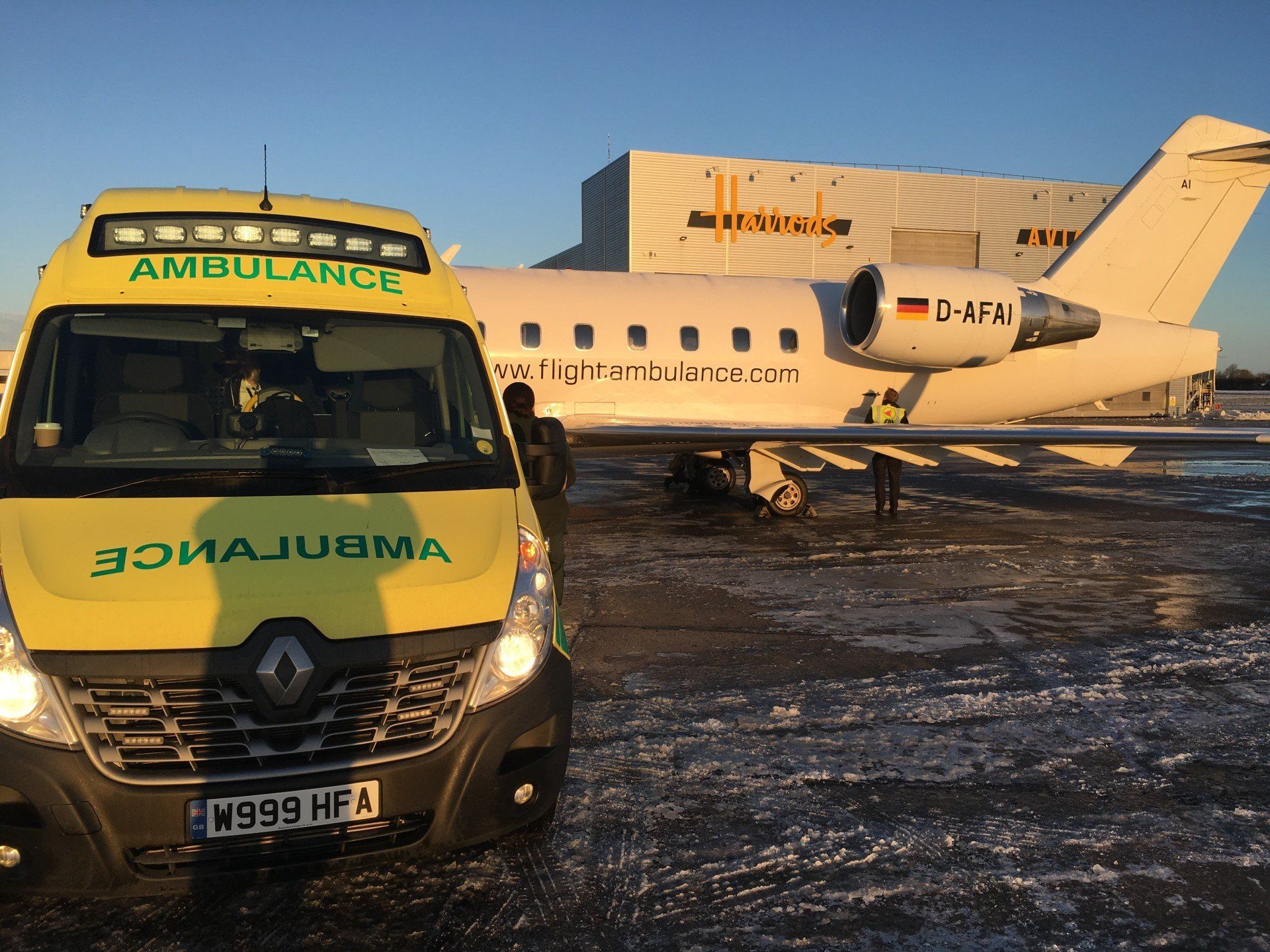 Hearts First Ambulance Service vehicle with a plane