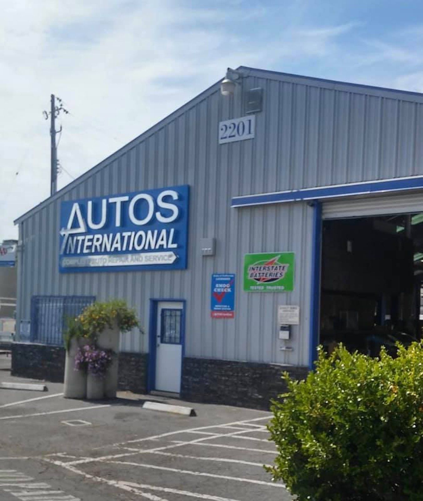 A building with a sign that says autos international
