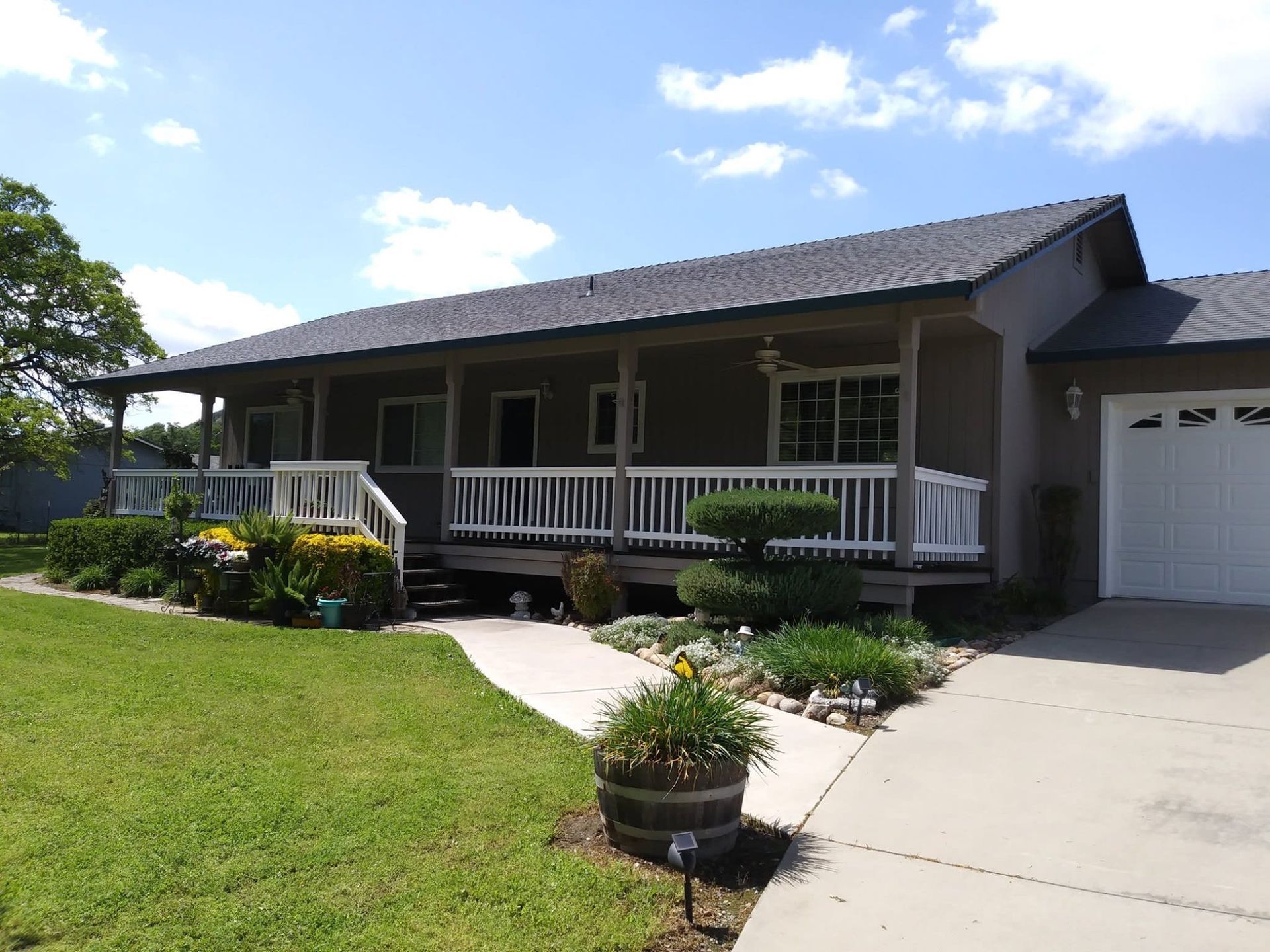 A house with a large porch and a white railing