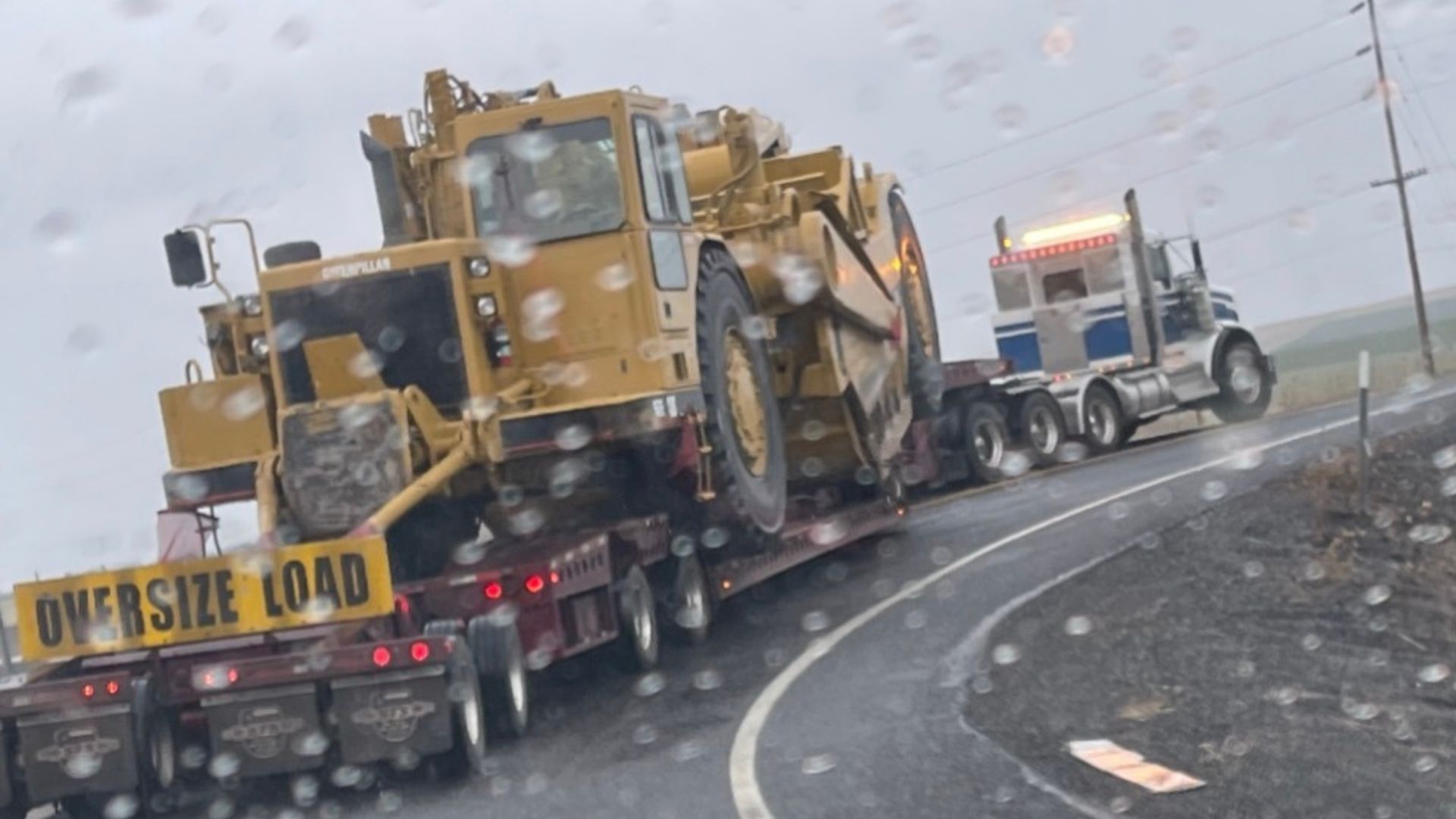 Oversized load pilot car support for multi-axle heavy haul transport in winter