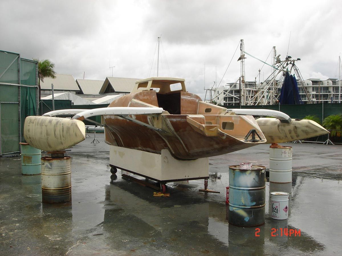 A Boat Is Sitting on A Trailer in A Parking Lot — Ashby Boat Builders In Buddina, QLD