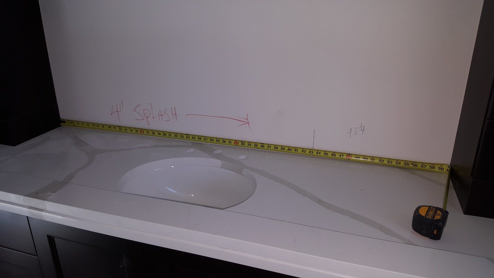 White Bathroom Sink with Measuring Tape — Naples, FL — Rain Forest Marble Inc.