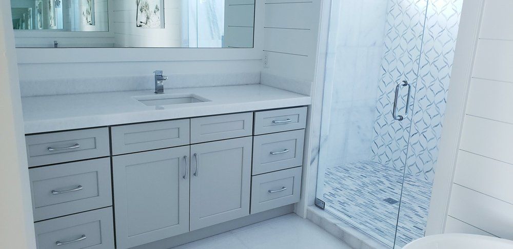 White Bathroom with White Theme Cabinet — Naples, FL — Rain Forest Marble Inc.