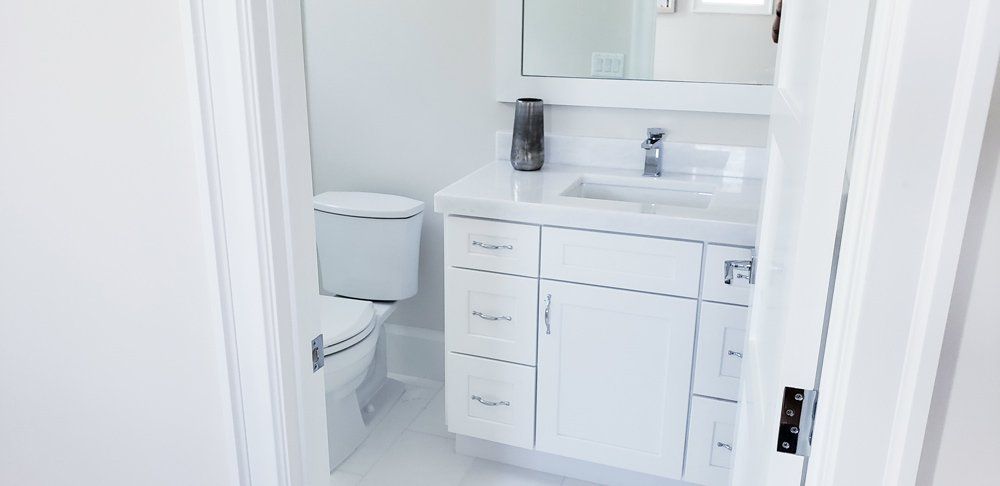 Clean and White Bathroom and Toilet — Naples, FL — Rain Forest Marble Inc.