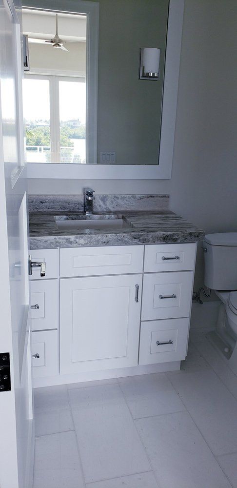 Bathroom with Mirror and Drawers — Naples, FL — Rain Forest Marble Inc.