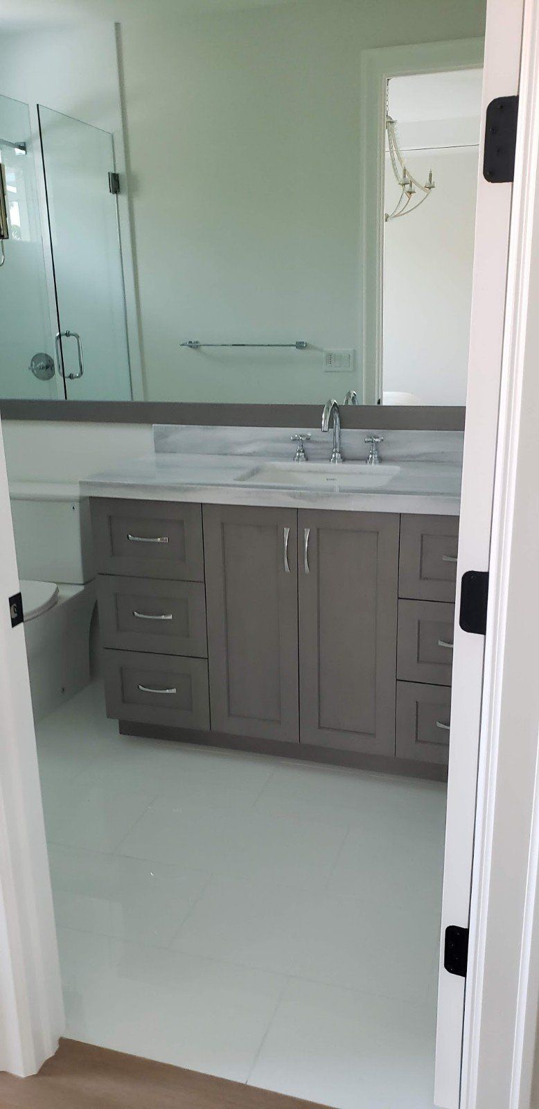 A Bathroom with Six Drawer Cabinet and Door Style Drawer — Naples, FL — Rain Forest Marble Inc.