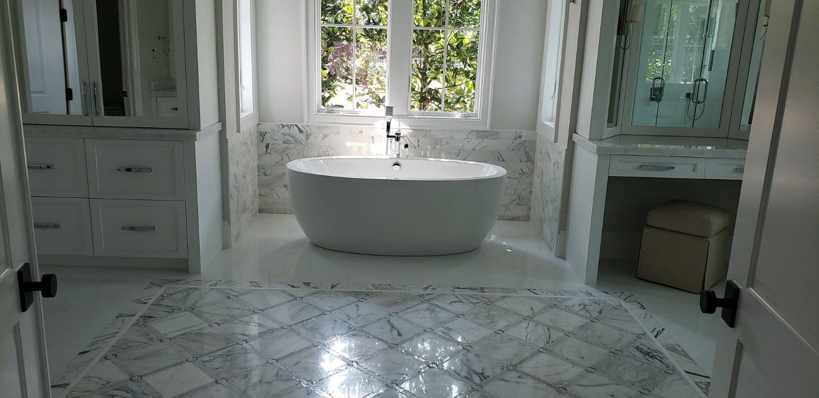 A Bathroom with Bath Tub and Window — Naples, FL — Rain Forest Marble Inc.