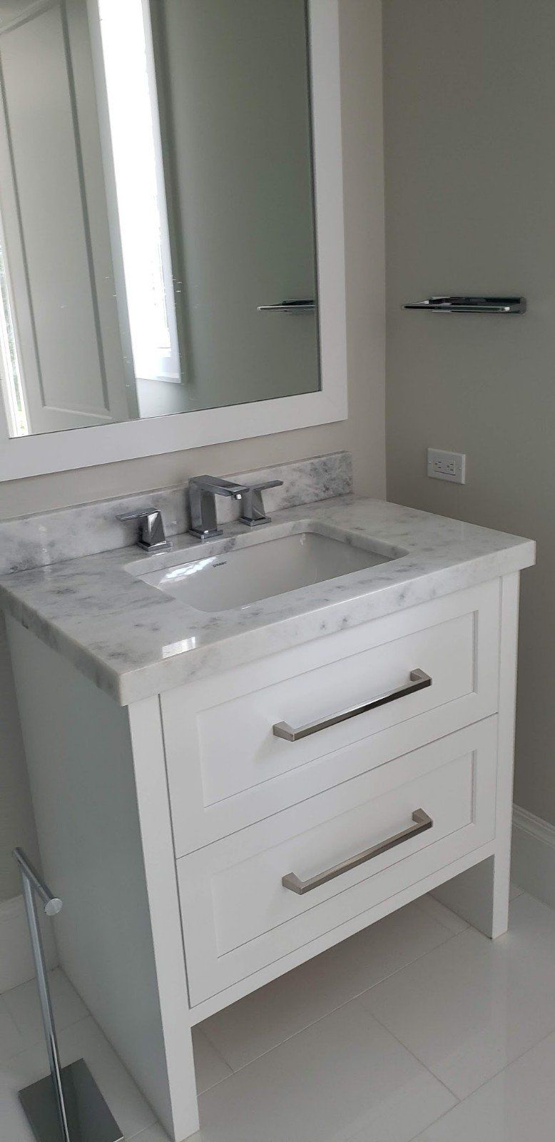 A Bathroom with Two Drawer Cabinet and a Mirror — Naples, FL — Rain Forest Marble Inc.