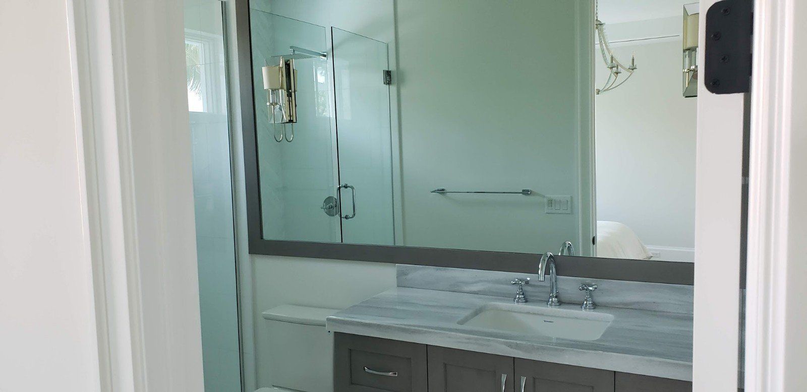 A Bathroom with Large Mirror — Naples, FL — Rain Forest Marble Inc.