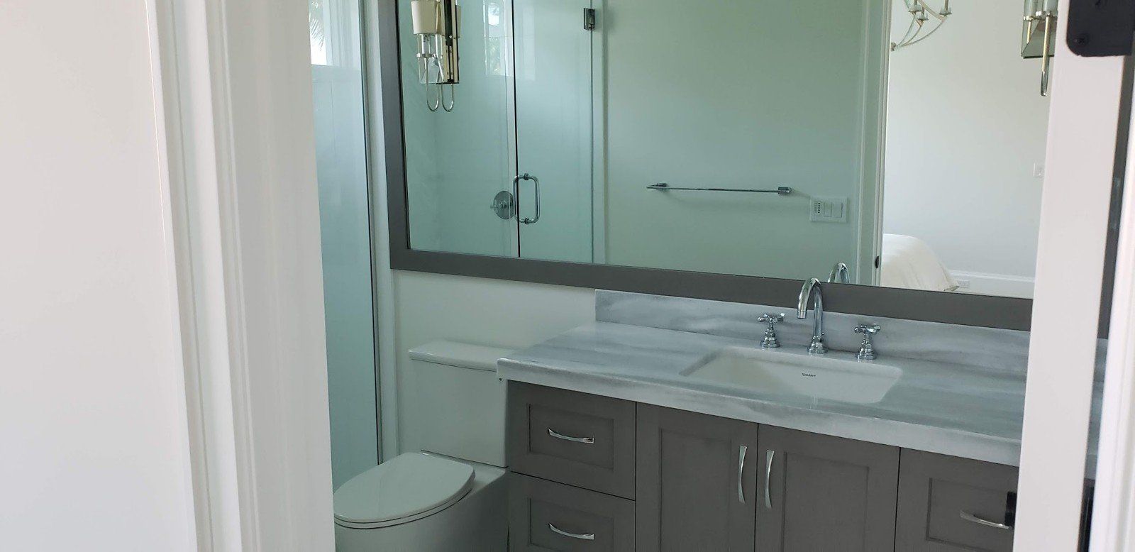 A Bathroom with Big Mirror — Naples, FL — Rain Forest Marble Inc.